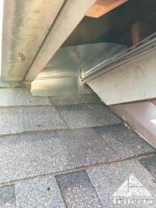 Raccoon exclusion process at a vinyl soffit return.