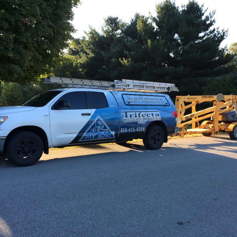 Trifecta Wildlife Services Truck With Aerial Lift The Trifecta Wildlife Services truck towing an aerial lift