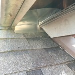 Raccoon exclusion process at a vinyl soffit return.