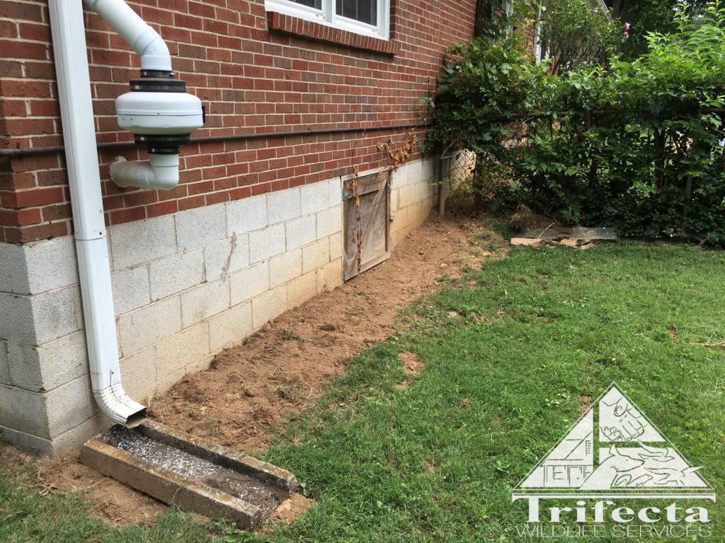 A completed traditional dig barrier install