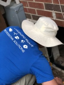 Tim providing wildlife services installing a custom crawl space door