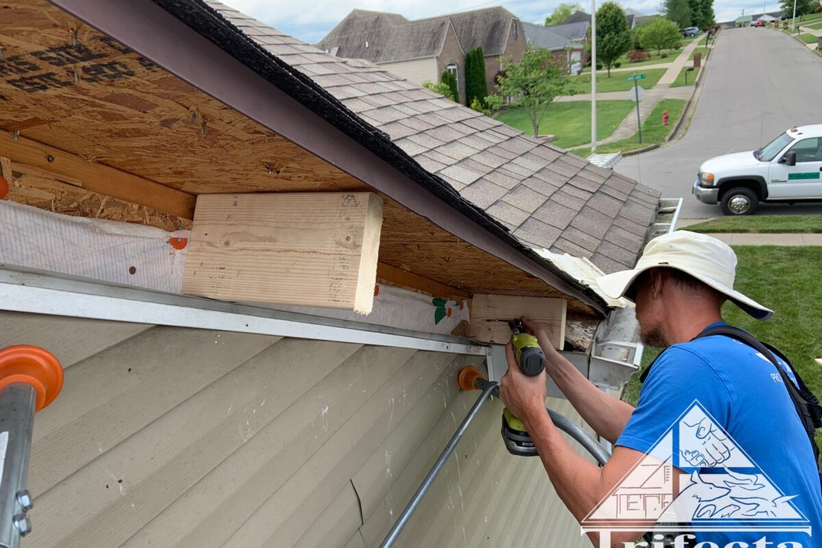 Tim installing cross braces for the new fascia board to secure to
